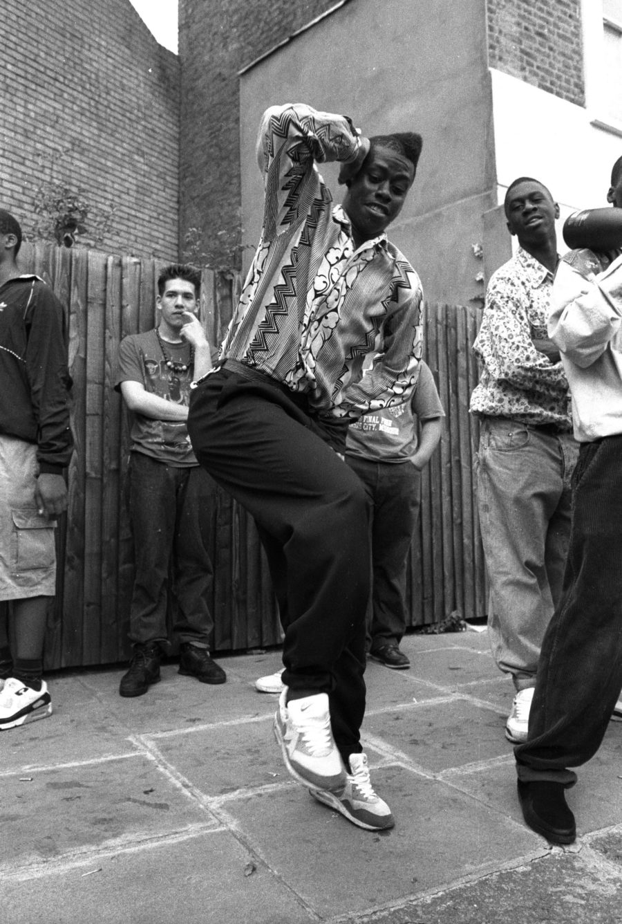 A man with a flat top dancing, Notting Hill Carnival, 1980s © Giles Moberly