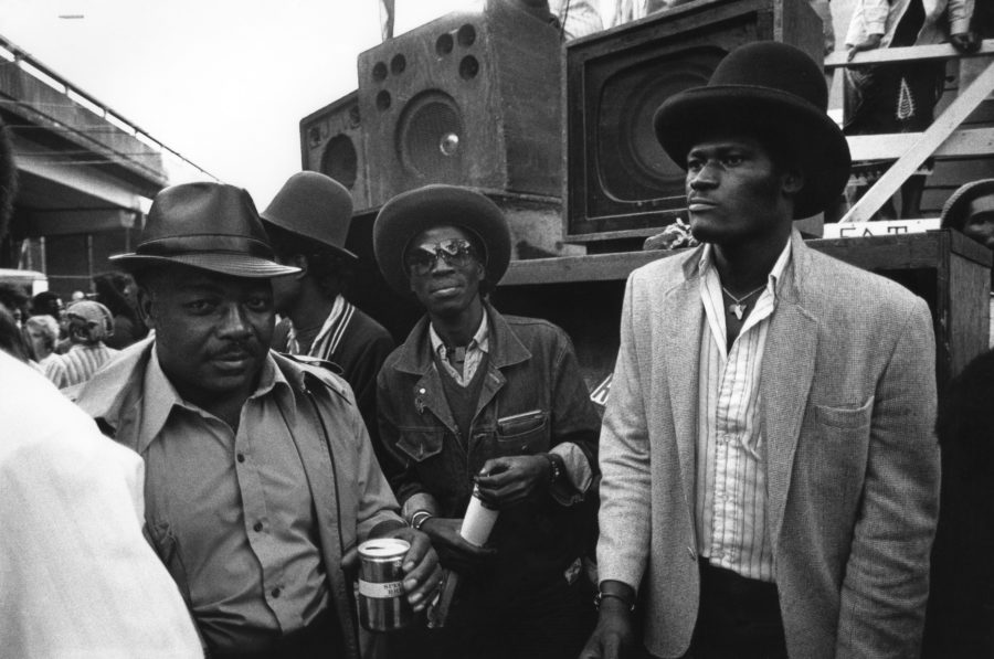 Three men by a sound system, Notting Hill Carnival, 1983 © Peter Anderson
